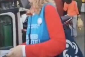 Increpan a una militante kirchnerista que repartía boletas con la pechera de Vacunate