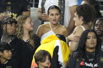 Entertainer Selena Gomez, center, is seen along with rapper Tyga, left, during the second half of a Major League Soccer match between Los Angeles FC and Inter Miami Sunday, Sept. 3, 2023, in Los Angeles. (AP Photo/Mark J. Terrill)�