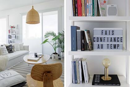 Entre los ventanales con cortinas roller, una biblioteca amurada laqueada en blanco con un cartel tipo marquesina con letras intercambiables y lámpara ‘Coco’ con base en tono oro mate (Lamps Crafts).