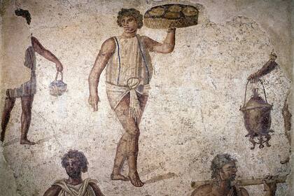 Escena de esclavos preparando un banquete en un mosaico conservado en Cartago (Túnez)