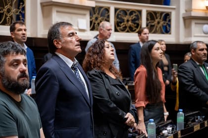 Eslaiman, con Tignanelli a su derecha y González, a su izquierda