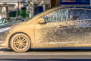 Extremely dirty car after driving on unrepaired damaged road