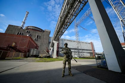 FILE - A Russian serviceman guards in an area of the Zaporizhzhia Nuclear Power Station in territory under Russian military control, southeastern Ukraine, Sunday, May 1, 2022. Inspectors from the International Atomic Energy Agency visited the sprawling plant in southern Ukraine on Thursday, Sept. 1, 2022 The IAEA’s Director General Rafael Mariano Grossi highlighted the risks they had to deploy a team in the area amidst the war. (AP Photo, File)