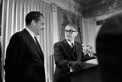 FILE -- From left, President-elect Richard Nixon and his adviser Henry Kissinger during a press briefing at the Nixon headquarters in the Hotel Pierre, New York, Dec. 2, 1968. Kissinger, the scholar-turned-diplomat who used cunning, ambition and intellect to remake American power relationships with the Soviet Union at the height of the Cold War, sometimes trampling on democratic values to do so, died on Nov. 29, 2023, according to a statement that was released by his consulting firm. He was 100. (Neal Boenzi/The New York Times)