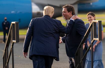 FILE — Gov. Ron DeSantis of Florida with former President Donald Trump at a campaign rally in Ocala, Fla., Oct. 16, 2020. Florida has become an unlikely laboratory for right-wing policy, pushed by DeSantis, a governor with presidential ambitions. (Doug Mills/The New York Times)