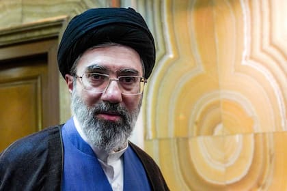 (FILES) In this picture obtained from Iran's ISNA news agency, Mojtaba Khamenei, son of Iran's supreme leader Ayatollah Ali Khamenei, looks on in Tehran on October 13, 2024. Iran marked the appointment of Ayatollah Mojtaba Khamenei to replace his father as its supreme leader with a new barrage of missiles against Israel and the Gulf states on March 9, 2026, as the Middle East war sent oil prices soaring. (Photo by Hamed JAFARNEJAD / ISNA / AFP)