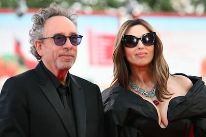 (FILES) US director Tim Burton and Italian actress Monica Bellucci attend the red carpet of the opening film "Beetlejuice Beetlejuice" presented out of competition during the 81st International Venice Film Festival at Venice Lido, on August 28, 2024. Tim Burton and Monica Bellucci announced their separation in a statement on September 19, 2025. (Photo by Alberto PIZZOLI / AFP)