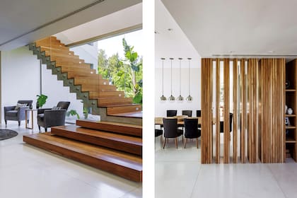 Debajo de la escalera, de 1,40 de ancho, un espacio de recepción. En el comedor, sillas ‘Hilaria’ con fundas en lino y terciopelo gris oscuro (Flora Home Bs. As.). Lámparas colgantes esféricas (West Elm).