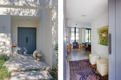 La puerta de entrada tiene un contrastante tono gris grafito que Agustina fue logrando con entonadores y que pasó por las sillas y la isla de la cocina, y se instala en la parrilla y en dos franjas de calcáreos al borde de la galería. En el pasillo, alfombra (Marhaba Carpets) y obra de Milo Lockett.