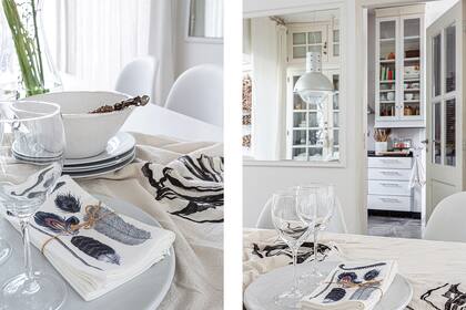 DESPUÉS: En lugar de un pasaplatos, un espejo que refleja los vidrios del vajillero. Mantel de gasa con estampa ‘Magnolia’ (Plain Textiles) y arreglo (Date el Gusto).