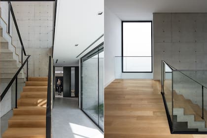 Escultórica. La escalera es de hormigón armado revestida de madera de roble y barandas de hierro. El patio de doble altura que tiene en frente la baña de luz natural.