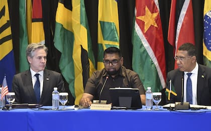 From left, U.S. Secretary of State Antony Blinken, Guyana's President Irfaan Ali and Jamaica's Prime Minister Andrew Holness attend an emergency meeting on Haiti at the Conference of Heads of Government of the Caribbean Community (CARICOM) in Kingston, Jamaica, on Monday, March 11, 2024. (AP Photo/Collin Reid)�