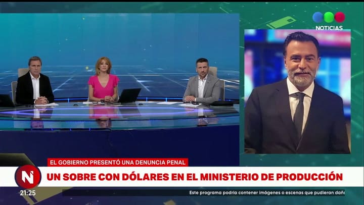 Un sobre con dólares en el ministerio de Producción - Fuente: Telefé Noticias