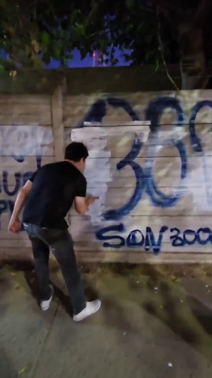 Ramiro Marra tapó un grafiti que Juan Grabois pintó en el Jockey Club