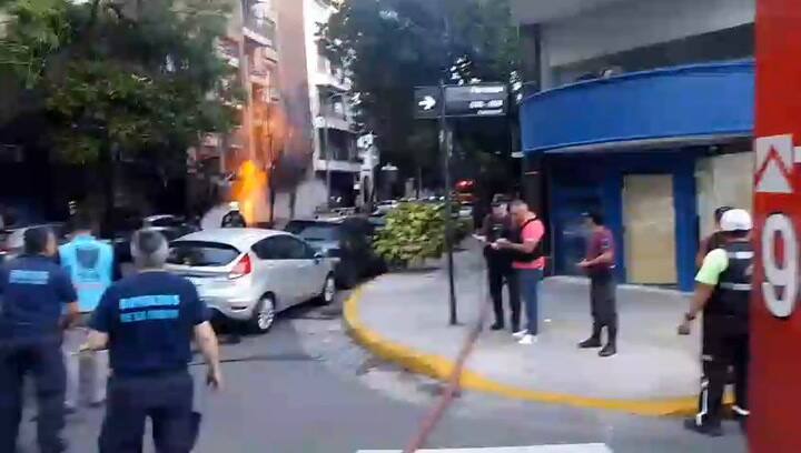 Firefighters work to extinguish the fire after the leak