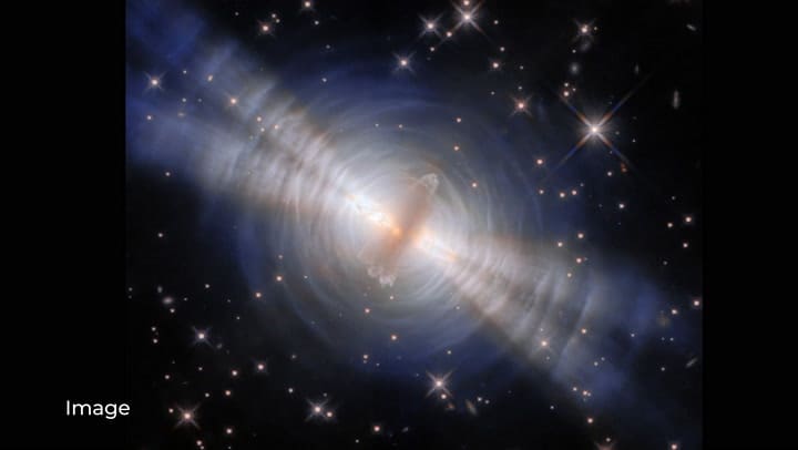 La luz de la estrella, bloqueada por el disco y los lóbulos, escapa hacia los polos y crea una especie de reflector doble