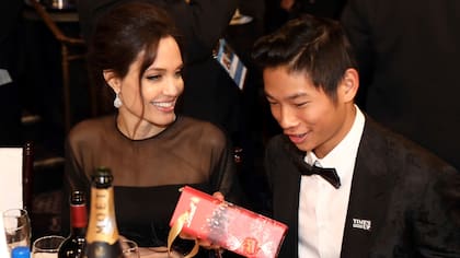 IMAGE DISTRIBUTED FOR LINDT CHOCOLATE - Angelina Jolie, left, and Pax Jolie-Pitt are seen at the Golden Globes sponsored by Lindt Chocolate on Sunday, Jan. 7, 2018 in Beverly Hills, Calif. (Photo by Matt Sayles/Invision for Lindt Chocolate/AP Images)