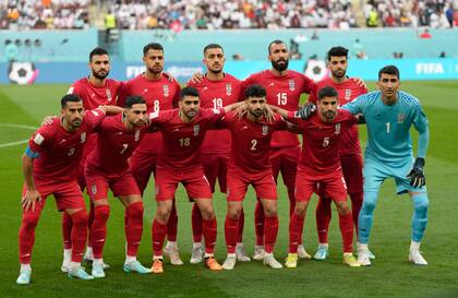 Iranian players pose ahead of the World Cup group B soccer match between England and Iran at the Khalifa International Stadium in Doha, Qatar, Monday, Nov. 21, 2022. (AP Photo/Frank Augstein)