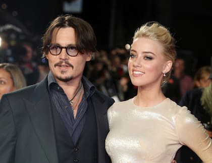 Johnny Depp y Amber Heard en el estreno de su película "The Rum Diary" en Londres. (Foto AP/Joel Ryan, archivo)