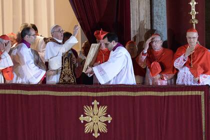Jorge Bergoglio, Pope-elect Francis I, appears with cardinals at the window of St. Peter's Basilica shortly after being elected, March 13