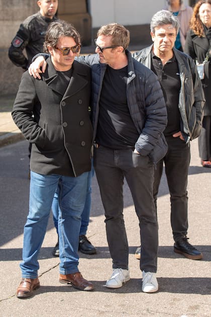 Juan Puig y Federico D'Elía. Detrás, Marcelo De Bellis.