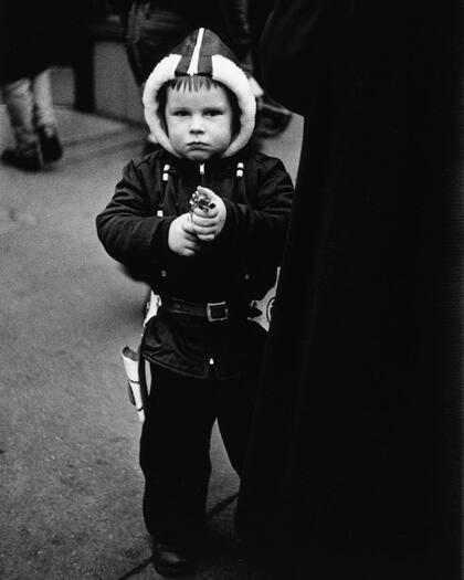 “Kid in a hooded jacket aiming a gun”, NYC, 1957.