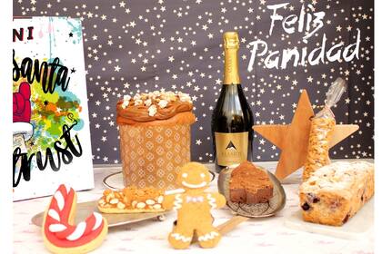 Kit "Felíz Panidad" con pan dulce a elección, nueces caramelizadas con páprika, brownie de chocolate negro, turrón con almendras, budín húmedo de frutos rojos y chocolate blanco, cookies de jengibre y una botella de espumante. Pani, $990