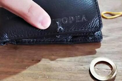 La billetera y el daño producido a la moneda