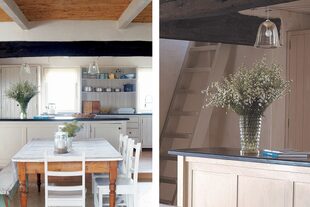 La cocina, integrada con el espacio social, se separa del resto por medio de un desnivel y un mueble-barra con tapa de madera.
