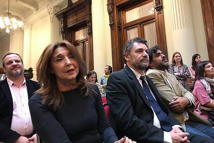 La Defensora de los Niños, Niñas y Adolescentes, Marisa Graham (izq.), y sus dos adjuntos, Fabián Repetto (centro) y Facundo Hernández (der.).