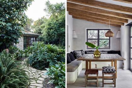 La entrada lateral conduce a la cocina y el comedor diario a través de un camino de piedra rodeado de vegetación blanda, todo un lujo en Mallorca.