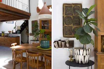 La escalera conduce a los dormitorios que quedaron en planta alta tras la remodelación. Macetón, plato de cerámica y lámparas colgantes (Castro Corbat).