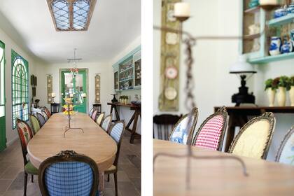 La contundencia de la mesa de roble claro, se suaviza ante la gracia de las sillas multicolor.