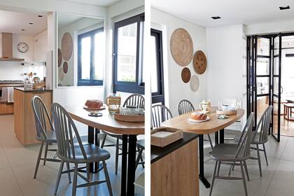 La mesa ovalada de la cocina (Bull para Larralde Spelzini), un “capricho” satisfecho, con sillas ‘Eclectic’ (Caro Prieto Interiors). La pared espejada refleja el verde de Plaza Alemania. Las esterillas redondas, recuerdos familiares.