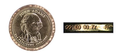 La moneda cuenta con un error de letras superpuestas de borde doble