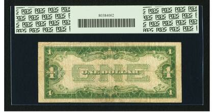 La pieza es denominada “funnyback” debido a su distintiva estética, con un número “ONE” de gran tamaño y ornamentación, en un tono verde claro que contrasta con el diseño en blanco y negro del anverso