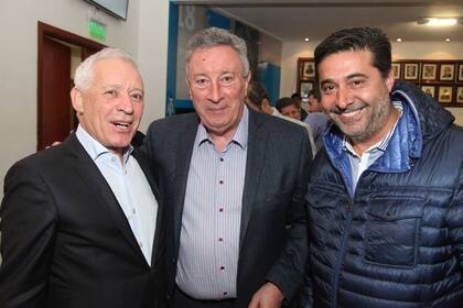 La sonrisa de Segura junto con Angelici y Blanco