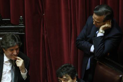 Los senadores Amado Boudou y Miguel Ángel Pichetto, presidente del Senado y del bloque oficialista respectivamente, el 22 de diciembre de 2011