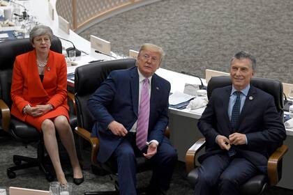 Theresa May, Donald Trump y Mauricio Macri
