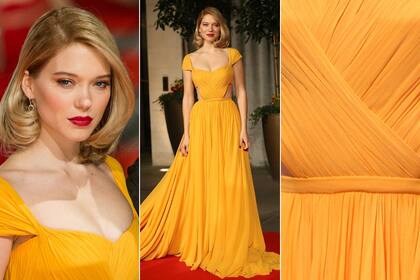 Léa Seydoux deslumbró con un vestido drapeado en color mostaza, con cut-outs laterales, de Prada