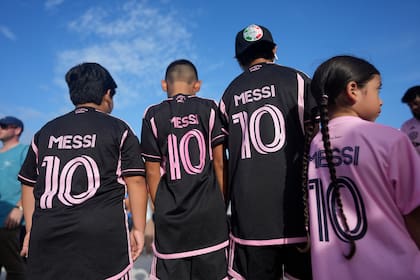 Lionel Messi fans from North Lauderdale, Fla., wait to enter the stadium before a Leagues Cup soccer match between Inter Miami and Cruz Azul, Friday, July 21, 2023, in Fort Lauderdale, Fla. (AP Photo/Rebecca Blackwell)