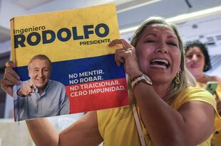 Los partidarios del candidato presidencial colombiano por la 'Liga de Líderes Anticorrupción' Rodolfo Hernández celebran en Cali, Colombia, el 29 de mayo de 2022