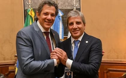 Luis Caputo y Fernando Haddad