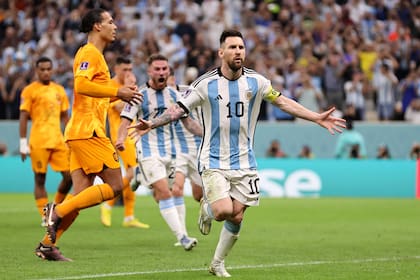 LUSAIL CITY, QATAR - DECEMBER 09: Lionel Messi of Argentina celebrates after scoring the team's second goal during the FIFA World Cup Qatar 2022 quarter final match between Netherlands and Argentina at Lusail Stadium on December 09, 2022 in Lusail City, Qatar. (Photo by Clive Brunskill/Getty Images)