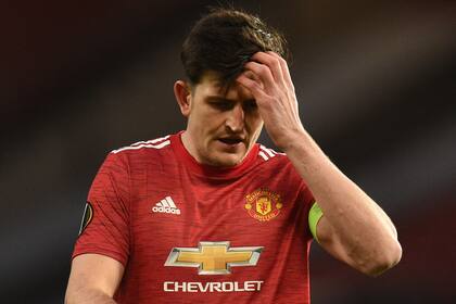 Manchester United's English defender Harry Maguire reacts during the UEFA Europa League round of 16 first leg football match between Manchester United and AC Milan at Old Trafford in Manchester, north west England, on March 11, 2021. (Photo by Oli SCARFF / AFP)