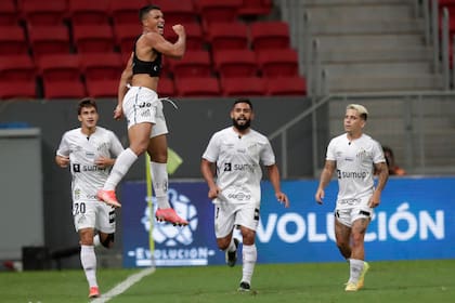 Marcos Leonardo of Brazil's Santos celebrates after scoring his side's opening goal during a Copa Libertadores soccer match against Argentina's San Lorenzo at the Mane Garrincha stadium in Brasilia, Brazil, Tuesday, April 13, 2021. (Ueslei Marcelino/Pool via AP)