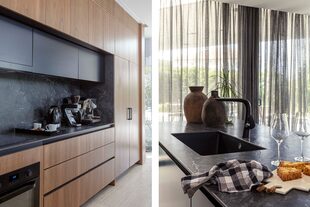 Mesadas y alzada de Neolith (De Stefano). Isla laqueada en negro. Grifería (Hansgrohe).