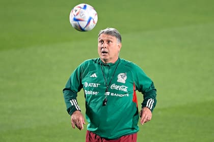 Mexico's Argentinian coach Gerardo Martino plays a ball during a training session of his team at Al Khor SC in Al Khor, north of Doha, on November 23, 2022, during the Qatar 2022 World Cup football tournament. (Photo by Alfredo ESTRELLA / AFP)
