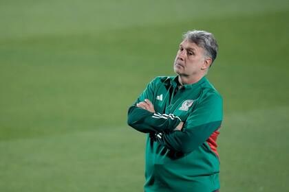 Mexico's head coach Gerardo Martino attends a training on the eve of the group C World Cup soccer match between Mexico and Poland, in Jor, Qatar, Monday, Nov. 21, 2022. (AP Photo/Moises Castillo)