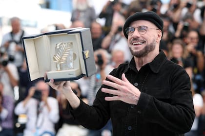 "Mis películas favoritas en mi vida siempre fueron las ganadoras de la Palma de Oro. No puedo creerlo, esto es más que un Oscar", dijo el intérprete de Grease al recibir el premio